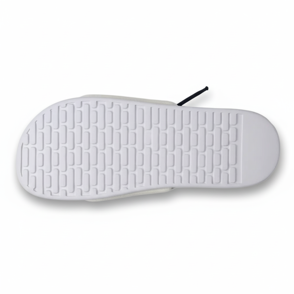 Nike slide suela blanca gris claro patrón rectángulos redondeados filas uniformes profundamente grabados vista aérea top-down