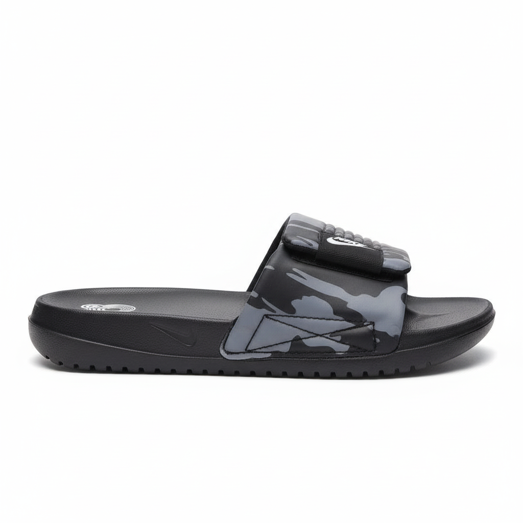 Sandalia negra con estampado gris Nike 012 vista lateral exacta todo referencia